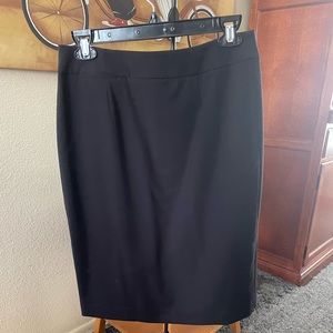 Calvin Kline, black skirt, zippered back, black shell lining, size 4